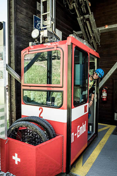 MTB rider Ludo May takes the Kalpertran cablecar to Embd, Switzerland on June 26, 2018.