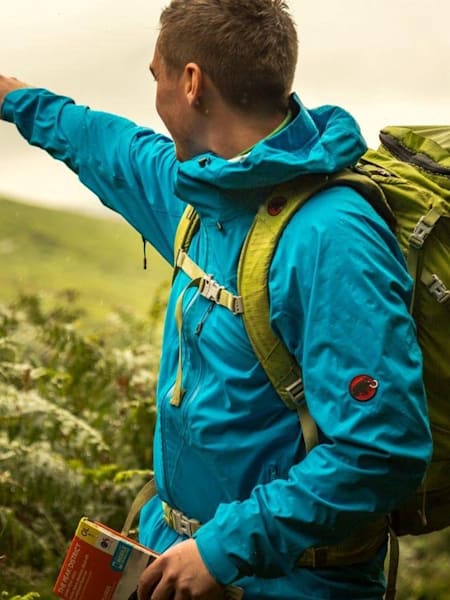 Hiker wears a Mammut jacket.