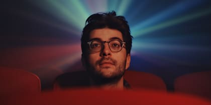 Sébastien 'Ceb' Debs sits in a cinema surrounded by light as he reflects on his Dota 2 career
