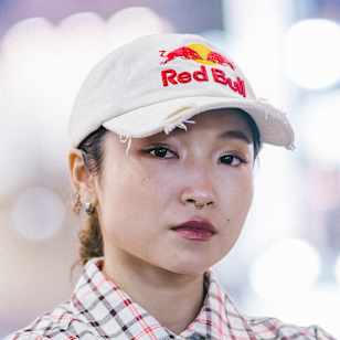B-Girl Ami stands confident in Shibuya during the December 2024 announcement of the Red Bull BC One World Final 2025 in Tokyo, embodying dynamic street style and dance culture