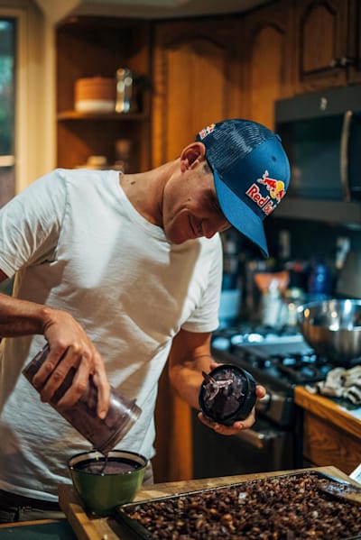 Braden Currie prepares a protein shake while training for the Kona Ironman.