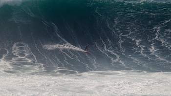 Surfer Maya Gabeira turns off the bottom on a big wave at Nazarein Portugal.