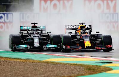Max Verstappen of Red Bull Racing Honda passes Lewis Hamilton of Mercedes at the Emilia Romagna Grand Prix on April 18, 2021.
