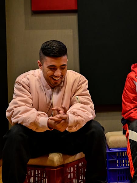 Encore ABJ and Calm share a joke in a recording studio.