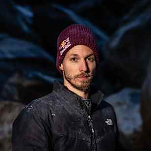 Felipe Camargo, wearing a Red Bull beanie, poses for a portrait in Ticino, Switzerland during 2025, embodying the adventurous Red Bull spirit against rugged alpine backdrops.