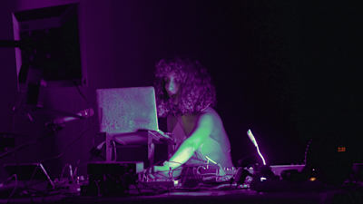 A photo of Lebanese DJ and artists Jessika Khazrik performing at the Museum Of Modern Art Warsaw.