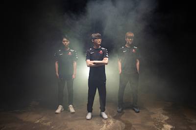 Faker, Cuzz and Teddy standing in smoke