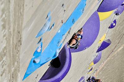 In 2024, Jessica Pilz climbs a challenging multi-pitch route at Verzasca Dam during Red Bull Dual Ascent in Switzerland