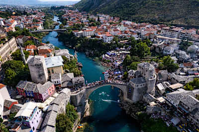 Aerial view of Stari Most and the packed riverbanks during the final competition day of the third Red Bull Cliff Diving World Series stop in Mostar, Bosnia and Herzegovina, on 6 September 2025