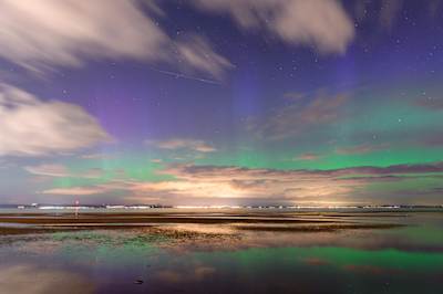 The Northern Lights and a shooting star over the Firth of Forth