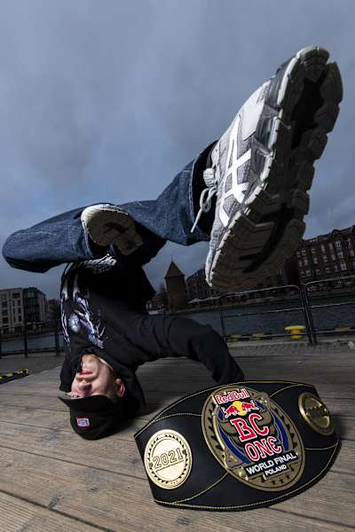 B-boy Amir of Kazakhstan poses for a portrait with the Red Bull BC One World Final winner belt in Gdansk, Poland on November 7, 2021.