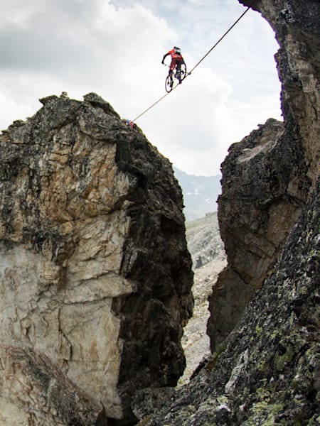Kenny Belaey crosses the rock gap on a high line during his Balance project in La Plagne, France on July 13th, 2015