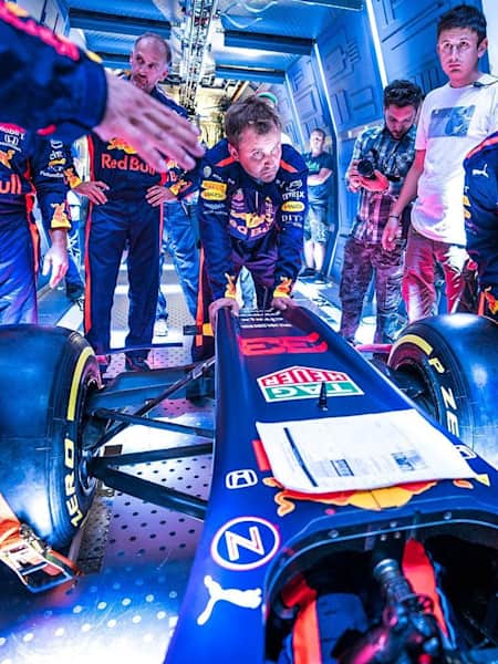 Aston Martin Red Bull Racing’s mechanics pictured performing the Zero-G pitstop aboard an aircraft in Russia.