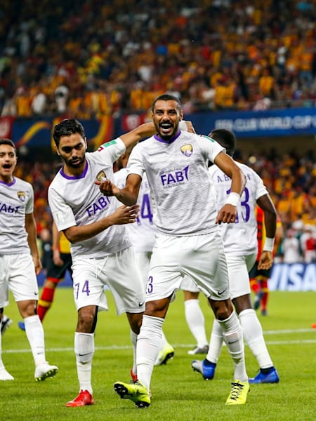 Al Ain FC_s Mohamed Ahmed, right, celebrates after scoring a goal