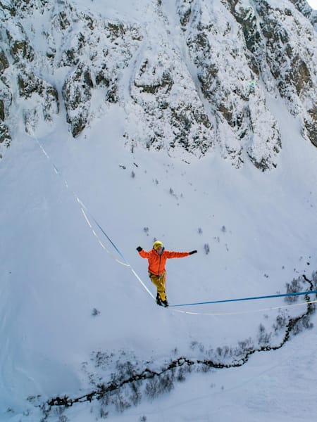 Lukas Irmler is seen crossing a highline between two icefalls.