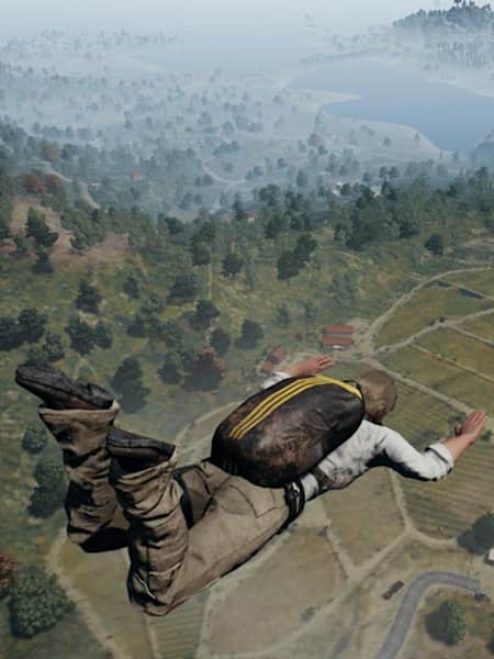 A player sky dives onto the island in PLAYERUNKNOWN’S BATTLEGROUNDS.
