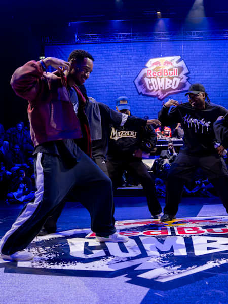 A team at Red Bull Combo in Paris performing an improvised group part on a branded floo in January 2026.