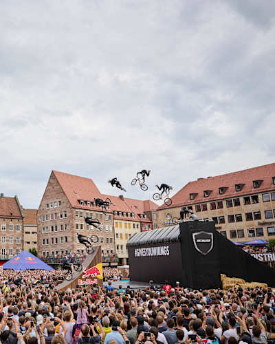 An MTB rider performs in front of spectators at Red Bull District Ride 2022 in Nuremberg, Germany