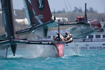 Emirates Team New Zealand chat ORACLE TEAM USA during the first weekend of racing at the 35th America's Cup finals in Bermuda on June 18, 2017.