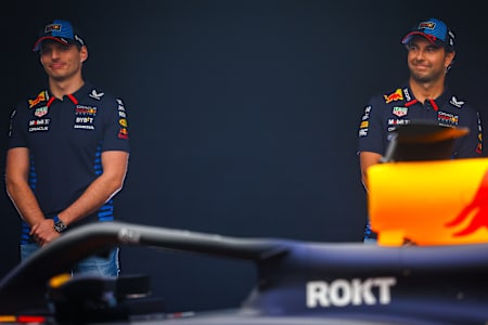 Max Verstappen of the Netherlands and Oracle Red Bull Racing and Sergio Perez of Mexico stand with the RB20 during the RB20 car launch at factory on February 15, 2024 in Milton Keynes, England.