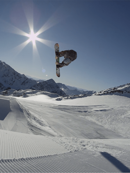 Snowboarder Marcus Kleveland landing a Quad Cork 1800