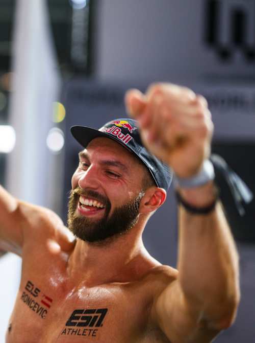 Alexander Rončević celebrates winning the HYROX Elite Doubles title.