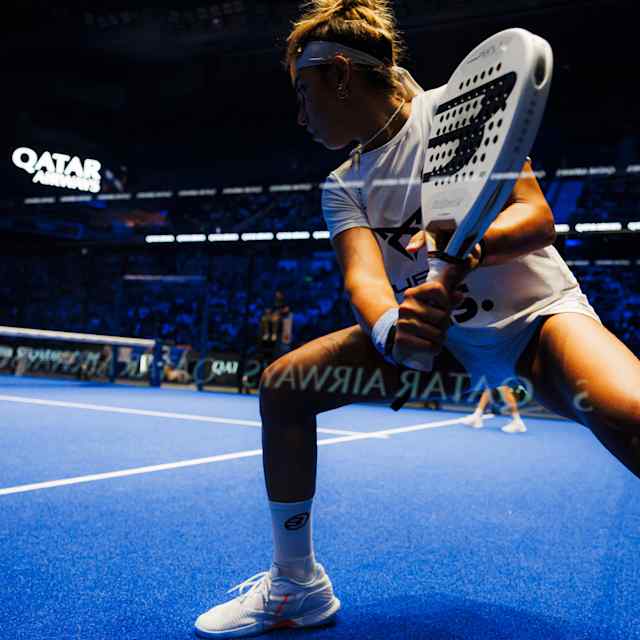 Beatriz González in action on the blue courts of Madrid at the 2025 Comunidad de Madrid Premier Padel P1 final, showcasing her dynamic play and Red Bull energy