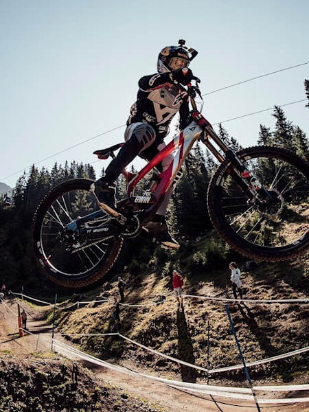 Aaron Gwin airs off a jump on the Lenzerheide World Champs course.