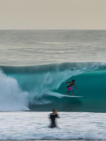 Scotty Hammonds photo of Indonesian local Usman Trioko catching a barrel during the huge June swells that hit the archipelago