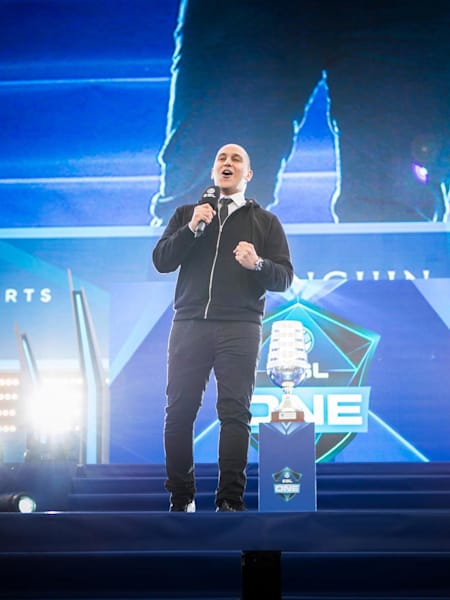 A photo of Eri Neeman hosting on stage at ESL One Frankfurt.