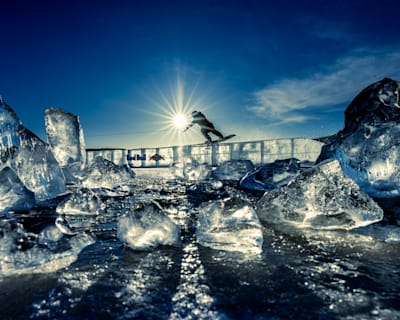 Wakeboarder slides over an ice rail during the filming of Frozen Lake Wake in Sweden.