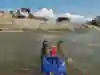 Local kids hang off Tarran Kent-Hume's kayak as he paddles through Peru on a 6,500km trek down the length of the Amazon river