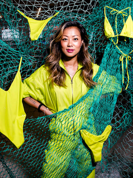 Katrine Lee Larsen surrounded by yellow Copenhagen Cartel swimwear