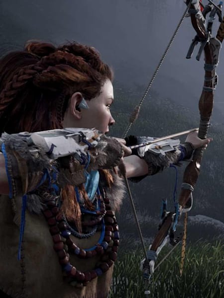 The Aloy lead character aiming at prey in the new Horizon Zero Dawn video game from Sony