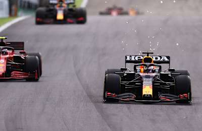 Max Verstappen drives ahead of Carlos Sainz in Ferrari at the 2021 Brazilian F1 Grand Prix