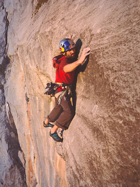 Kilian Fischhuber climbing the multi-pitch route Headless Children in the Rätikon mountain range in Switzerland.