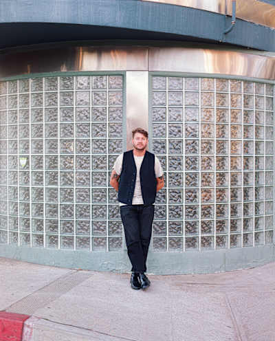 Axel Boman posing in front of a building.