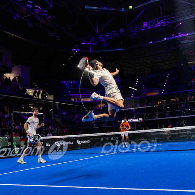 Stretching for a high shot during the Premier Padel tour