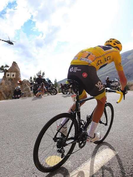 The leader of the Tour de France tackles a mountain road in France.