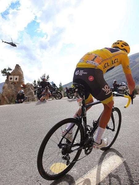 The leader of the Tour de France tackles a mountain road in France.
