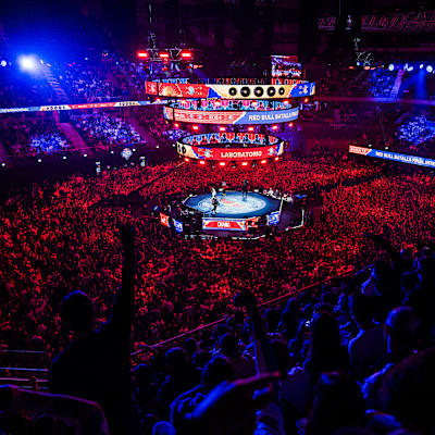 A packed crowd cheers at the Red Bull Batalla World Final 2024 in Madrid, Spain, where freestyle MCs battle under vibrant lights, capturing Red Bull's legendary high-energy atmosphere