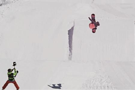 Katie Ormerod is mid flight performing the first double cork 1080 ever by a female snowboarder