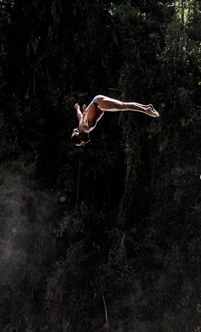 Orlando Duque of Colombia dives from the 27m platform during the sixth and final stop of the Red Bull Cliff Diving World Series at Rininahue waterfall, Lago Ranco, Chile on October 21, 2017.