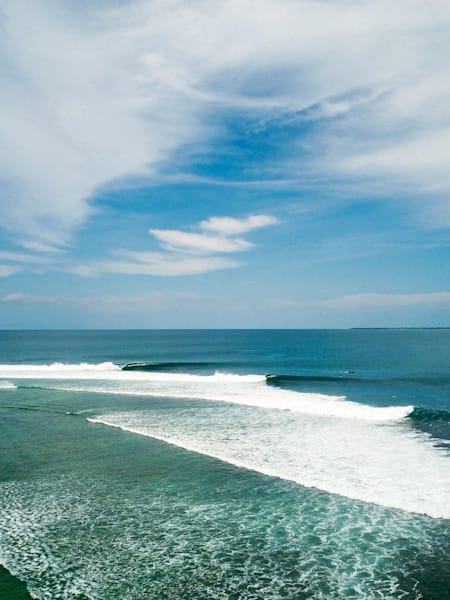 Perfect waves peel in the Mentawai Islands.