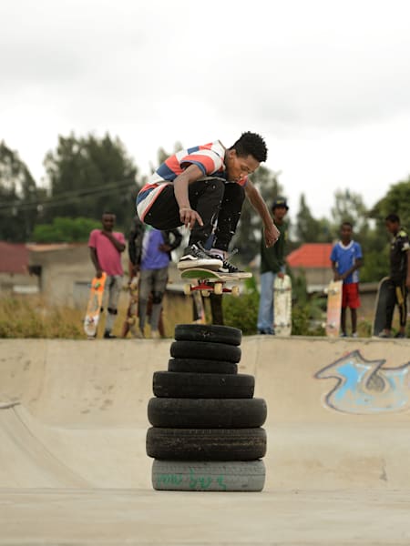 Ethiopian ripper Henok Yetbarek ollies stacked tyres at Awassa skatepark