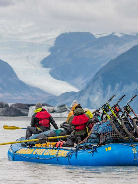 Wade Simmons, Darren Berrecloth, Tyler McCaul and Carson Storch paddle their dinghy.
