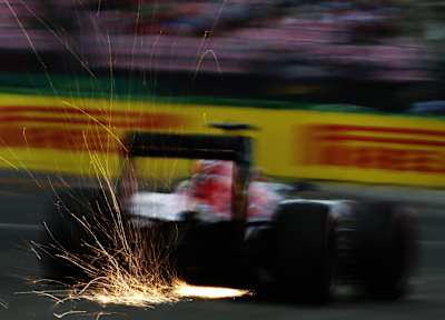 Sparks from Formula 1 car in the night