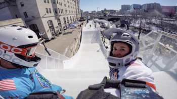 Reporter Dom Granger at the start of her training run at Red Bull Crashed Ice Ottawa with Reed Whiting
