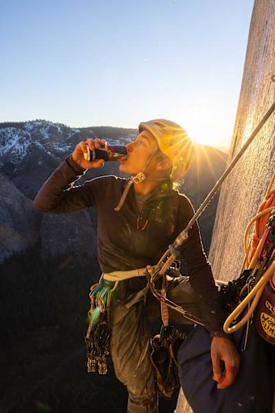 Sasha DiGiulian takes a drink from a can of Red Bull while climbing the Platinum Wall route on El Capitan in Yosemite National Park.