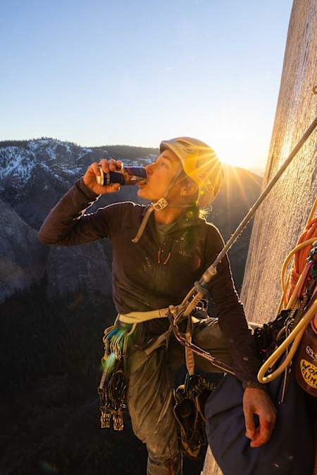 Sasha DiGiulian takes a drink from a can of Red Bull while climbing the Platinum Wall route on El Capitan in Yosemite National Park.
